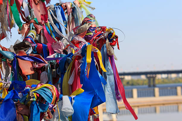 istock Multi-colored ribbons tied on the tree. Ritual 517608124