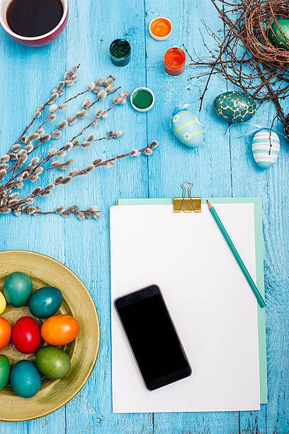 istock The top view of easter on wooden table office workplace 517609412