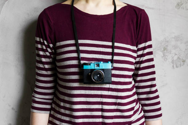 istock Woman with old lomo camera. 517609930