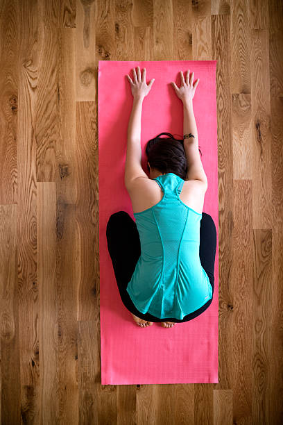 istock Physically Fit Young Woman Practicing Yoga Childs Pose Living Ro 517610714