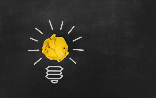 istock Inspiration concept crumpled paper light bulb metaphor 517611700