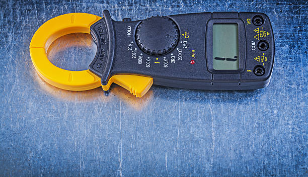 istock Digital ammeter on metallic background electricity concept 517611836