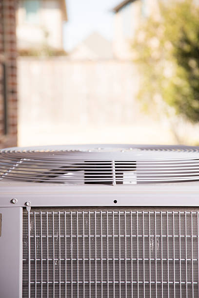 istock Air conditioner unit outside residential home. Summer 517612070