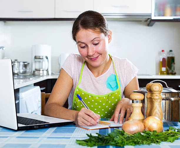 istock Woman looking for new recipe 517614266