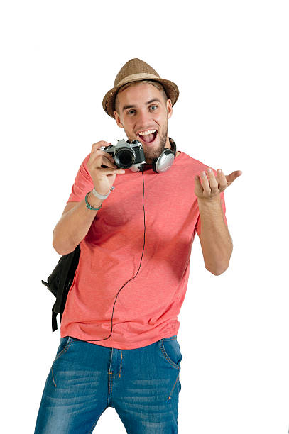 young handsome guy with film camera isolated on white