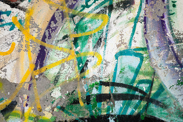 istock Abstract colorful paint graffiti fragment on gray urban wall 517617735