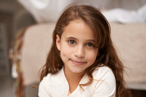 Portrait of a cute little girl at home