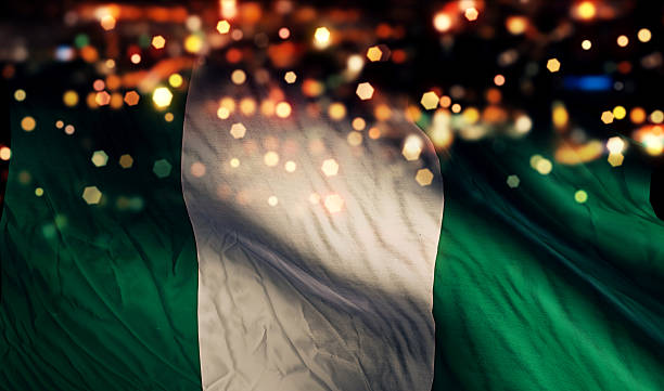 istock Nigeria National Flag Light Night Bokeh Abstract Background 517618983