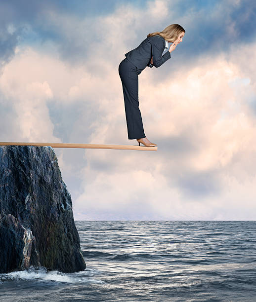 istock Businesswoman Walking the Plank 517625530