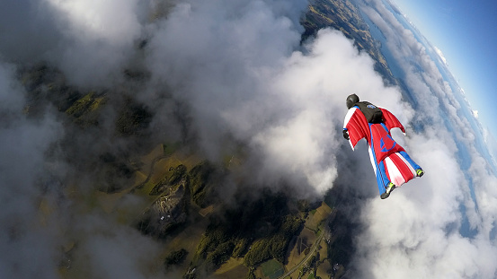 Young man paragliding with an instructor over beautiful mountain of Himachal Pradesh, Bir- Billing India.