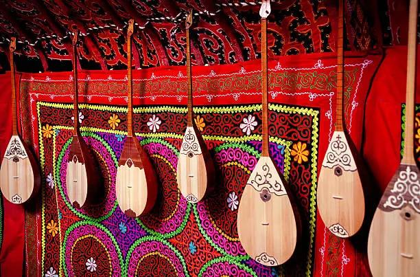 Dombra string instruments on the wall of Kazakh yurt at Nauryz celebration in Almaty, Kazakhstan