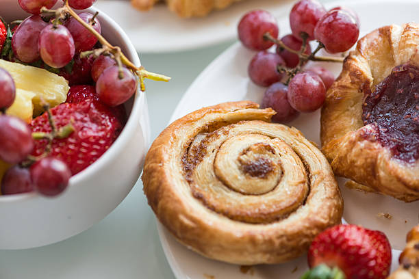 istock Continental Breakfast Buffet, Fresh Fruit, Cinnamon Bun and Danish Pastries 517633886