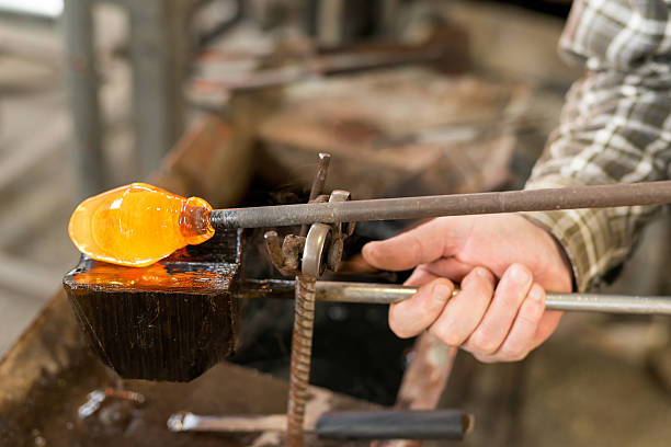 Handmade figures of melted glass Handmade figures of melted glass - selective focus, copy space hand blown glass stock pictures, royalty-free photos & images