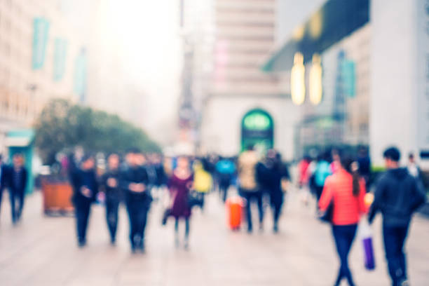 istock Defocused People Walking on Street 517635160
