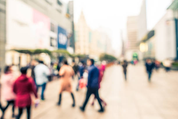 istock Defocused People Walking on Street 517635354