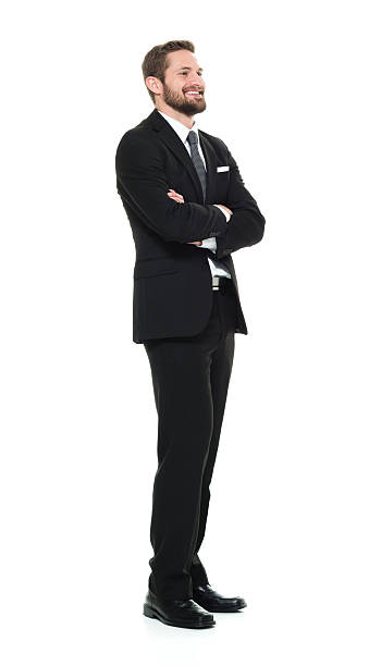 istock Smiling businessman standing with arms crossed 517636374