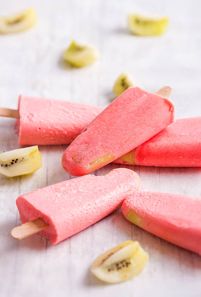 homemade popsicle with strawberries and kiwi stock photo