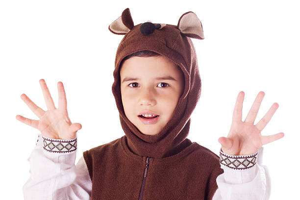 istock Cute little boy in a bear suit 517639571