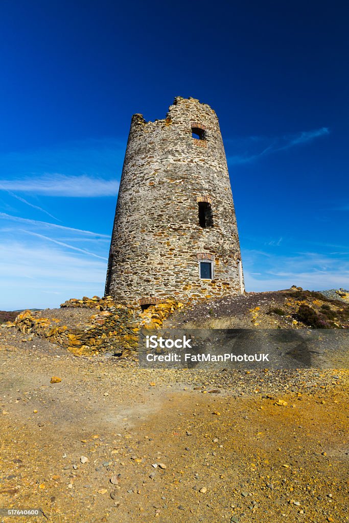 Ruined windmill on Parys Mountain Parys Mountain ex quarry with derelict lighthouse. Amlwch, Anglesey, Wales, United KingdomParys Mountain ex quarry with derelict lighthouse. Amlwch, Anglesey, Wales, United Kingdom Abandoned Stock Photo