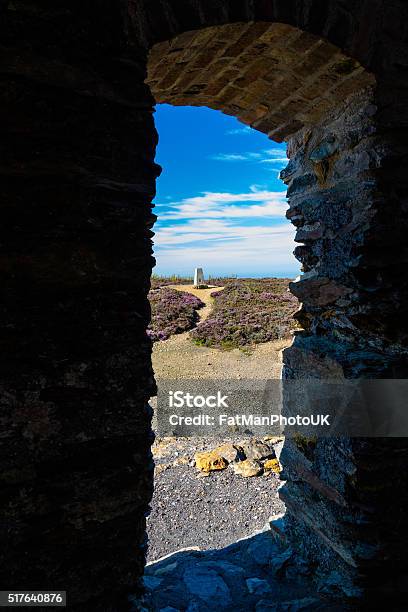 Trig Point Seen Through Arch Parys Mountain Stock Photo - Download Image Now - Abandoned, Anglesey - Wales, Arch - Architectural Feature