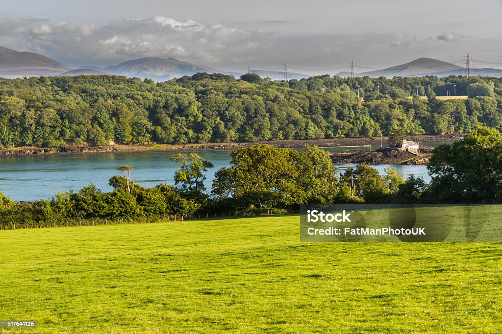 Menai Straits Looking East across the Menai Straits to Snowdonia, from Anglesey, North Wales, United Kingdom. Anglesey - Wales Stock Photo