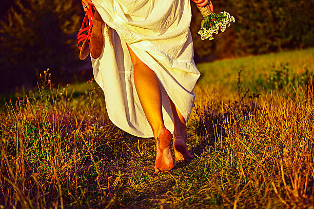 istock Beautiful girl walking at sunset 517645285