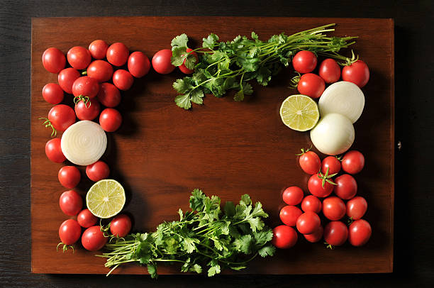 istock Fresh Salsa Ingredients Laying on a Wooden Board 517646219