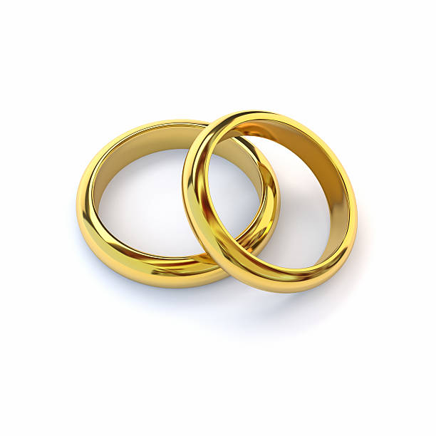 istock Two gold wedding bands on white background. 3d render. 517654360