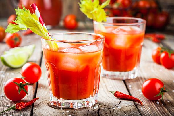 istock tomato juice with celery and ice in glasses 517654702