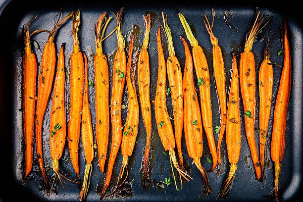 istock baked organic carrots with thyme 517655004