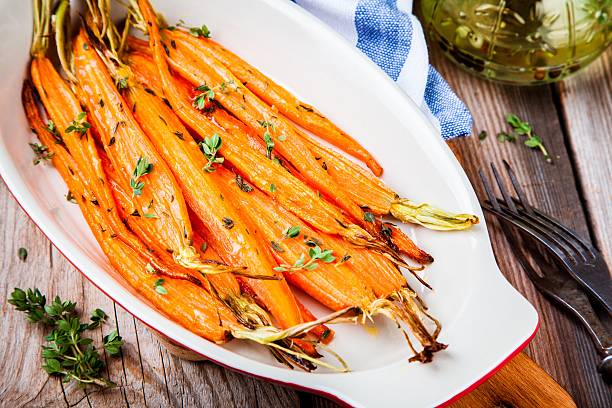 istock roasted organic carrots with thyme closeup 517655206