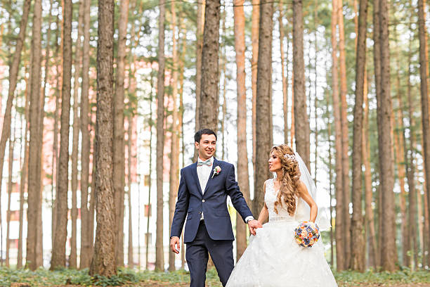 istock Bride and Groom at wedding Day walking Outdoors on spring 517661796