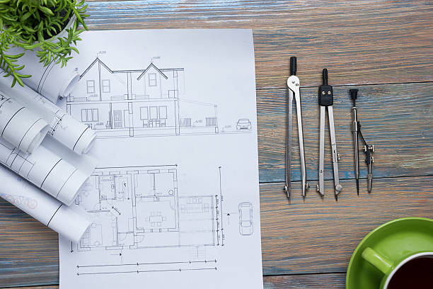 Architect worplace top view. Architectural project, blueprints, blueprint rolls and