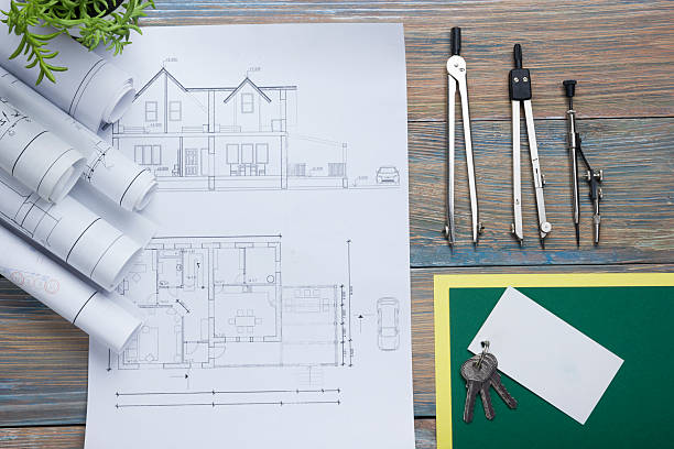 istock Real Estate concept. Architectural project, blueprints, blueprint rolls and  divider 517662420