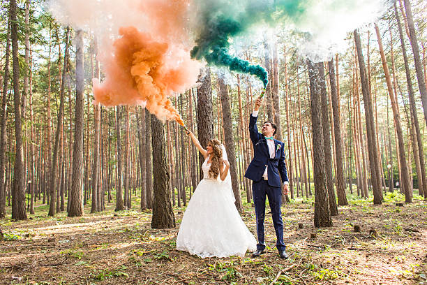 istock The bride and groom  with   smoke bombs on the background 517662832