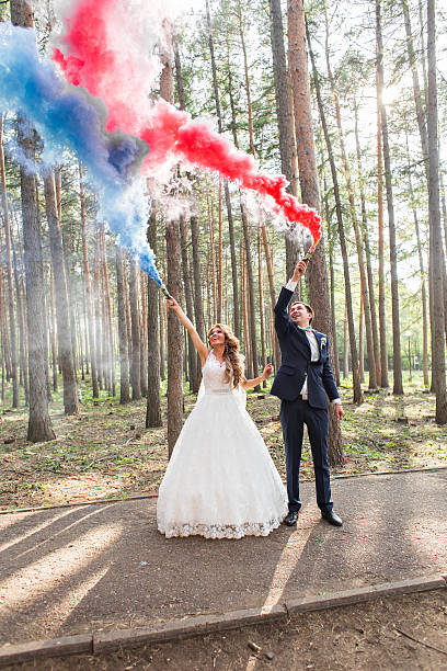 istock The bride and groom  with   smoke bombs on the background 517662906