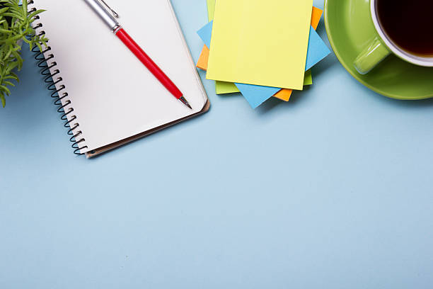 istock Office table with supply and coffe cup. View from above 517665574
