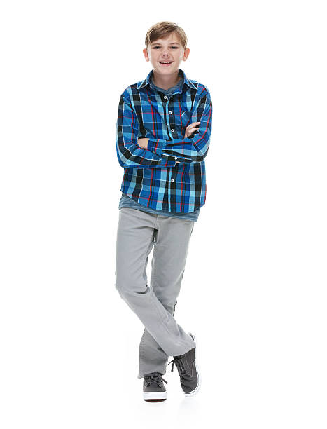 istock Smiling little boy standing with arms crossed 517666658
