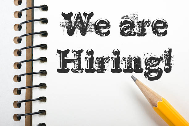 istock We are Hiring. Notpad and pencil. Top view 517666956