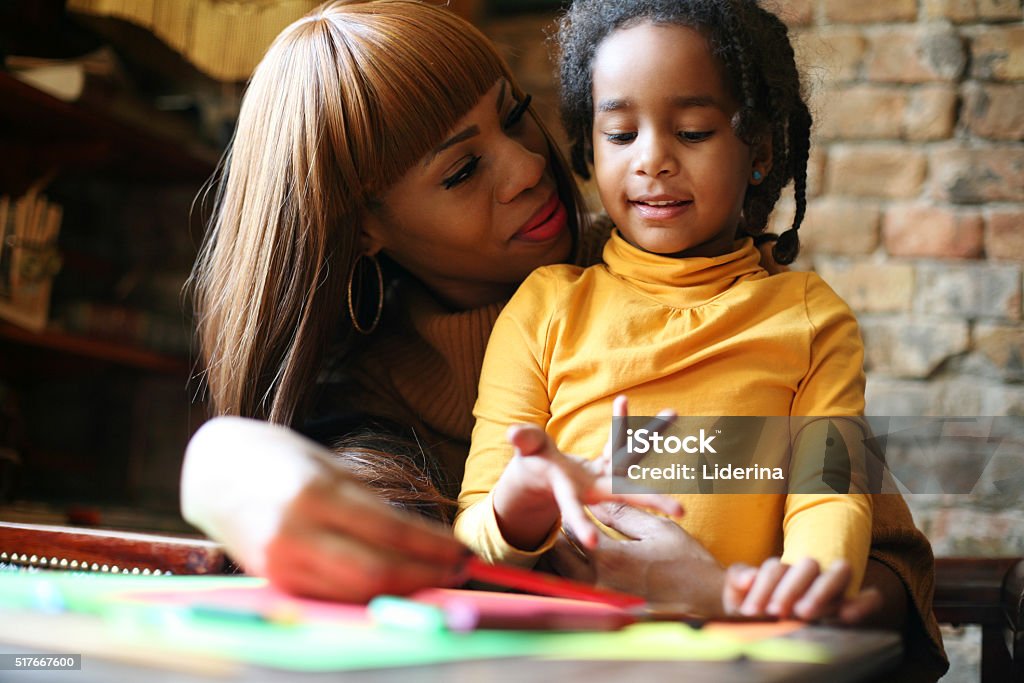 Like mother like daughter. Portrait of a young African American woman and her daughter learning together. African-American Ethnicity Stock Photo