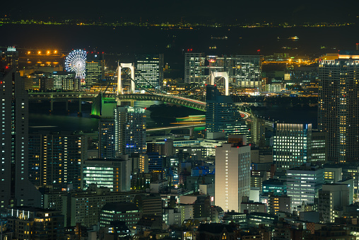 night cityscape of Odaiba landmark, Ferris wheel, Rainbow bridge, and Fuji TV building