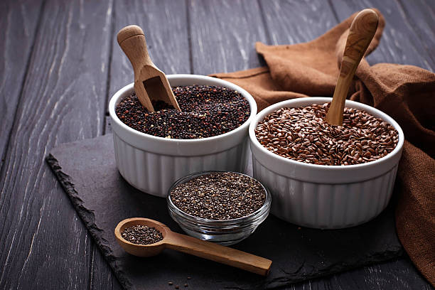 Various superfoods chia, quinoa, flax seed stock photo