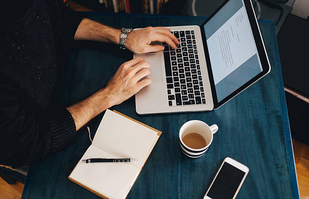 istock Young man typing at the laptop 517668420