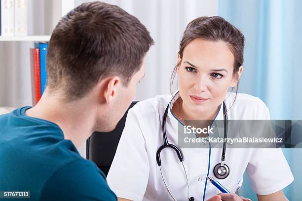 Man Having Medical Consultation Stock Photo - Download Image Now - Adult, Apron, Beautiful People