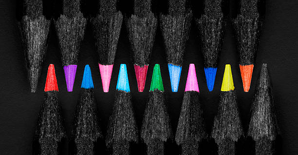 istock Set beautiful black, colored pencils on black background 517672397