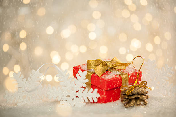 istock Red Christmas Gift, Bokeh Lights and Snowflakes 517673053