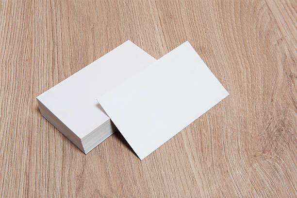 istock Blank Business Cards on wood texture 517673383