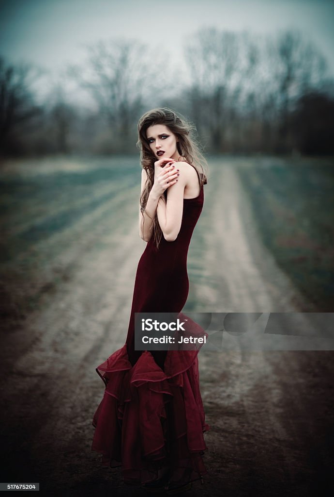 Beautiful sad girl in the autumnal field A beautiful sad girl in the autumnal field Adult Stock Photo