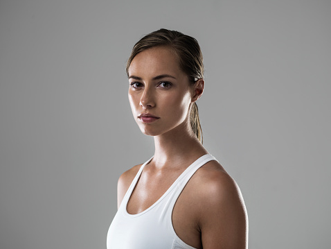 Cropped shot of an attractive brunette looking confident about her upcoming workout