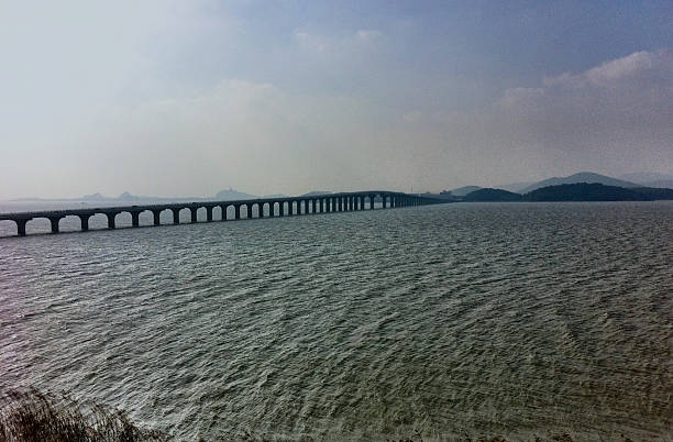 istock Highway Bridge Connecting Islands In Suzhou Lake Area. 517676471